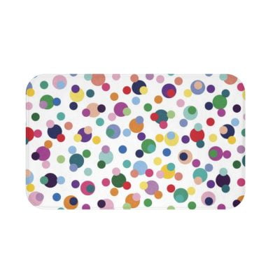 A vibrant and playful microfiber bath mat for kids, adorned with colorful polka dots in various sizes. Non-slip, quick-drying, and mold-resistant.