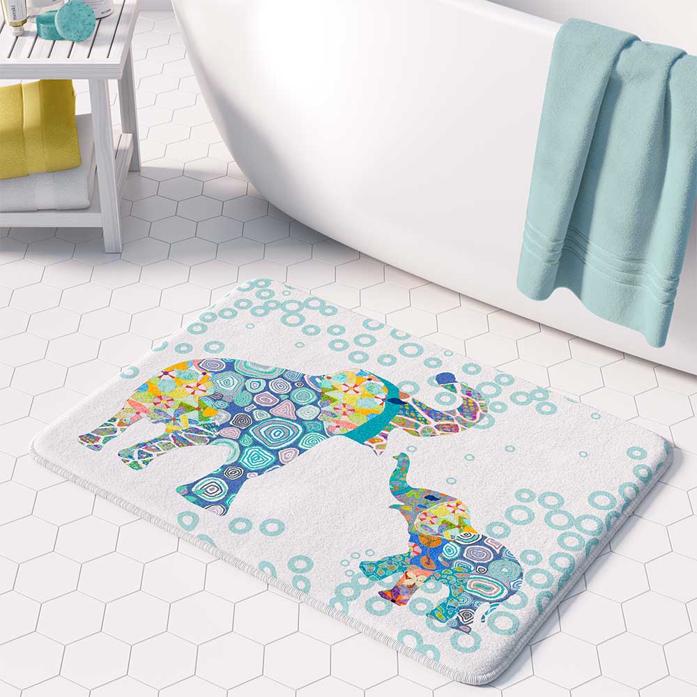 A white microfiber non slip bath mat for toddler boys featuring a charming blue elephant print. Mold and mildew resistant, plush, soft, non-slip, machine washable, and quick drying.