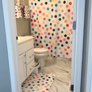 Kids bathroom with fun shower curtain in bright playful design