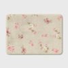 Beige bath mat with shabby chic rose floral print
