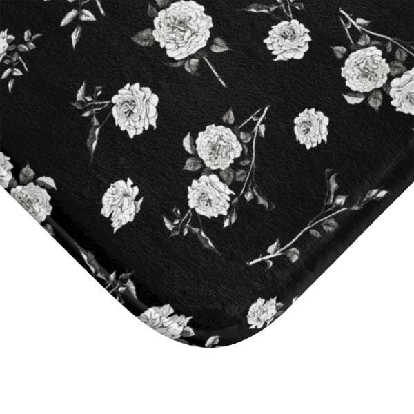 Close-up of intricate rose design on black & white bath mat