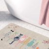 Beige bath mat featuring artist-designed floral cats and pink roses
