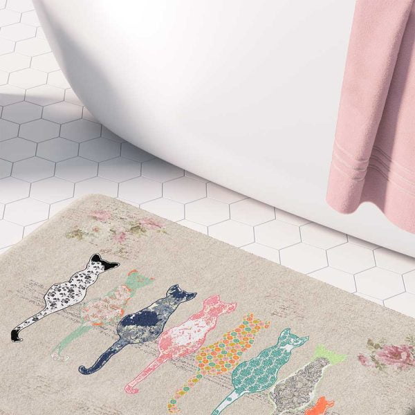 Beige bath mat featuring artist-designed floral cats and pink roses