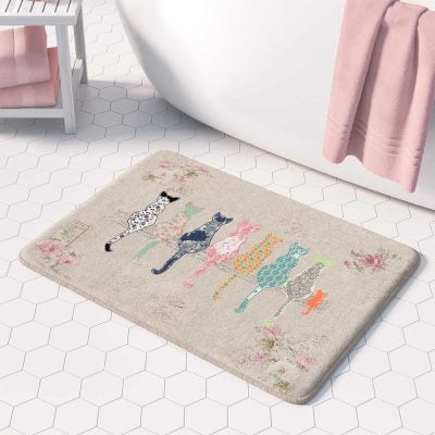 Beige bath mat featuring artist-designed floral cats and pink roses