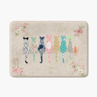 Beige bath mat featuring artist-designed floral cats and pink roses