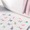 close up comfortable bath mat with cats
