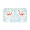 Stay comfortable and dry with this blue and pink flamingo bath rug