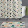 Abstract design shower curtain with water-resistant fabric.
