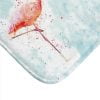 Close up of adorable pink flamingo design on blue bath rug