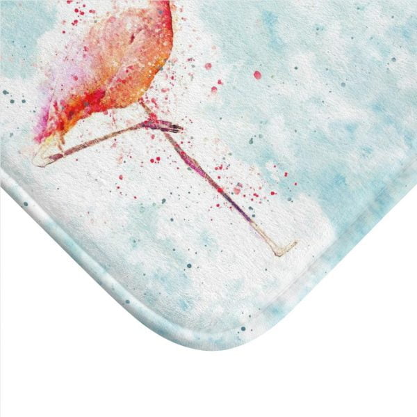 Close up of adorable pink flamingo design on blue bath rug