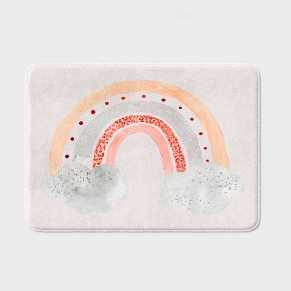 kids non slip bathroom rug with peach and pink stormy cloud rainbow print