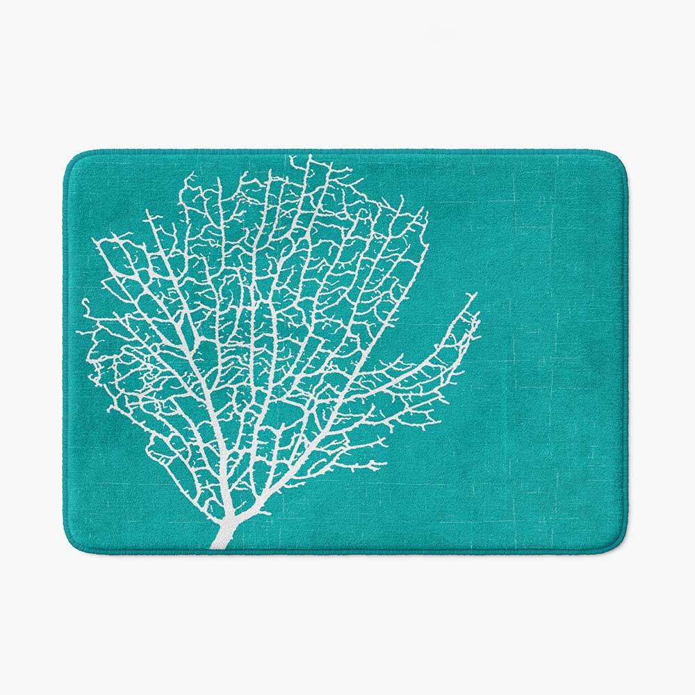 Aqua and white bath mat with coral pattern.