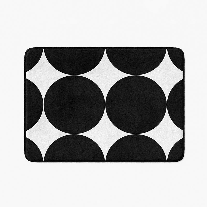 Black and white geometric patterned microfiber bath mat with artist-designed pattern.