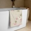 Beige bath towel with pink floral blurred rose print