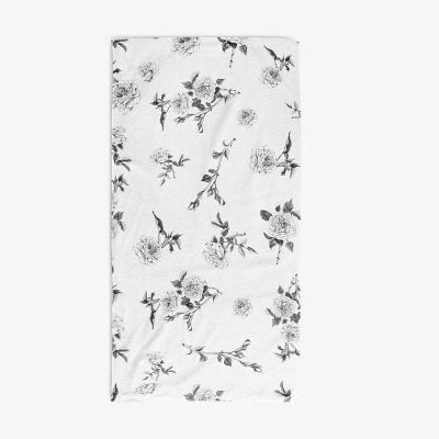 White bath towel with black floral rose pattern