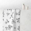 white hand towel with black floral rose pattern