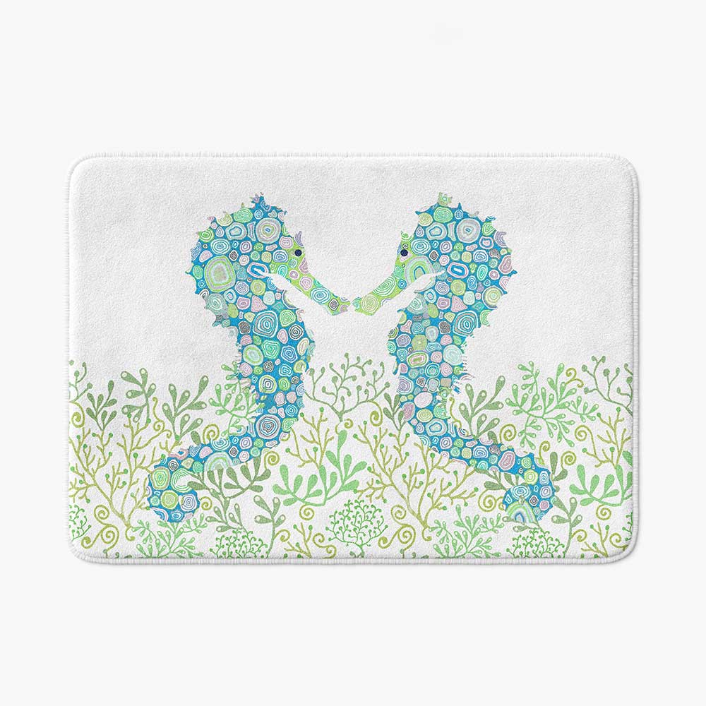 Non-slip microfiber bath mat for kids' bathroom with blue and green seahorse pattern.