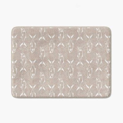 Beige non-slip bath mat featuring white trevally fish design.