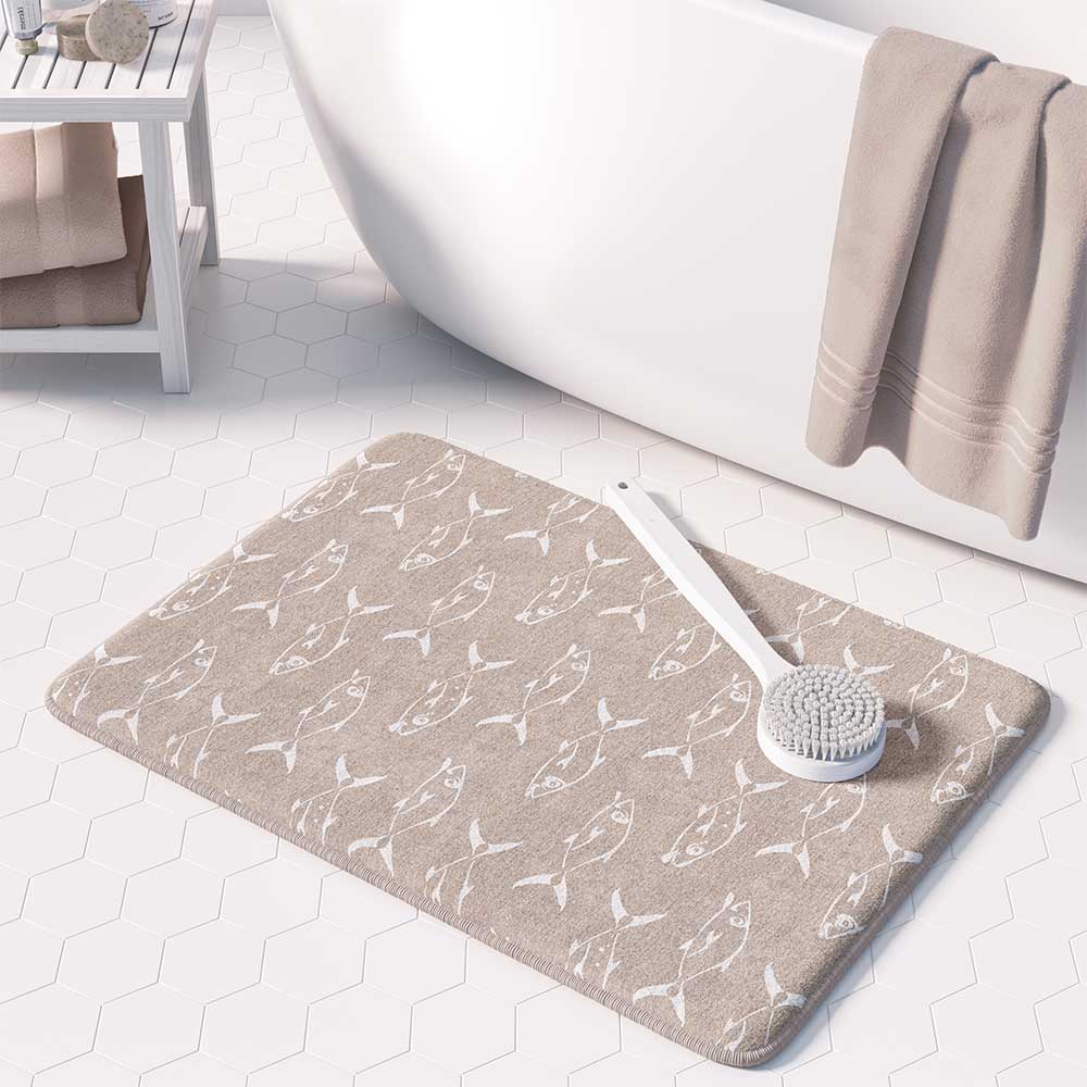 Beige non-slip bath mat featuring white trevally fish design.