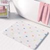 Non slip microfiber bath mat with pastel love hearts pattern.