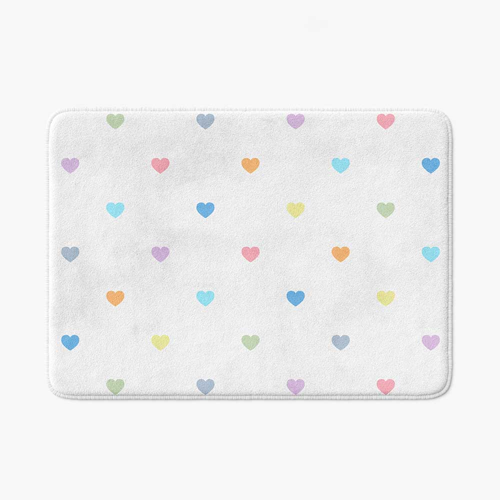 Non slip microfiber bath mat with pastel love hearts pattern.