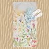 Colorful wildflower floral patterned beach towel with velour front and cotton terry back.