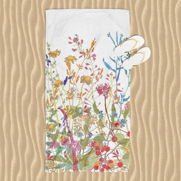 Colorful wildflower floral patterned beach towel with velour front and cotton terry back.