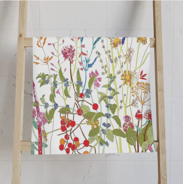 Colorful wildflower floral patterned hand towel with velour front and cotton terry back.