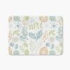 A soft and elegant botanical printed non slip microfiber bath mat.