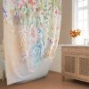 Bathroom setting with watercolor wildflower fabric shower curtain.