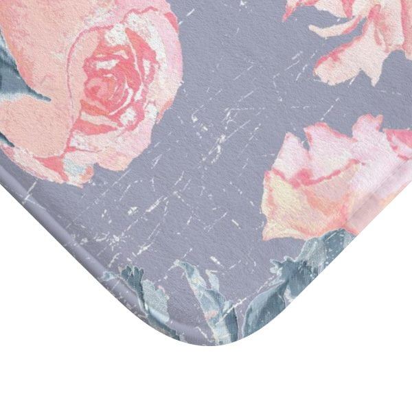 A vintage pink rose watercolor floral bath mat in lavender purple, perfect for adding elegance to any bathroom. Mold and mildew resistant, quick-drying, non-slip plush microfiber, washable.