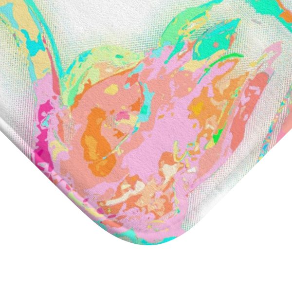 A vibrant pink flamingo tropical bathroom bath mat, perfect for adding a touch of tropical flair to any bathroom. Mold and mildew resistant, quick-drying, non-slip plush microfiber, washable.