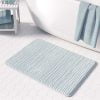 A coastal blue striped bath mat perfect for a small bathroom, master, or guest bathroom. Mold and mildew resistant, quick-drying, non-slip plush microfiber, washable.