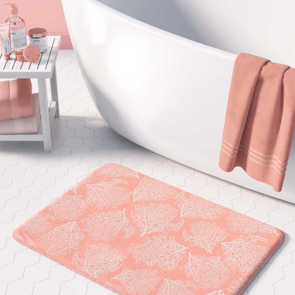 Pink coral patterned microfiber bath mat for coastal bathroom vibe.