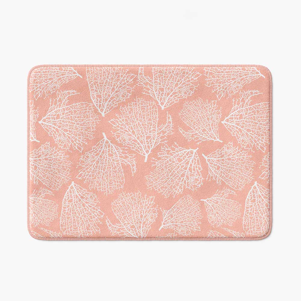Pink coral patterned microfiber bath mat for coastal bathroom vibe.