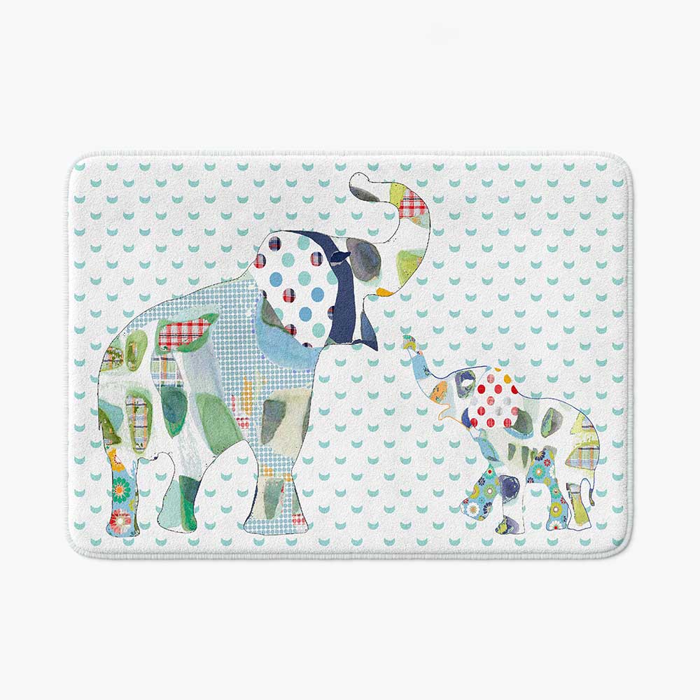 A white microfiber non slip bath mat for kids featuring a playful blue and green elephant print. Mold and mildew resistant, plush, soft, non-slip, machine washable, and quick drying.