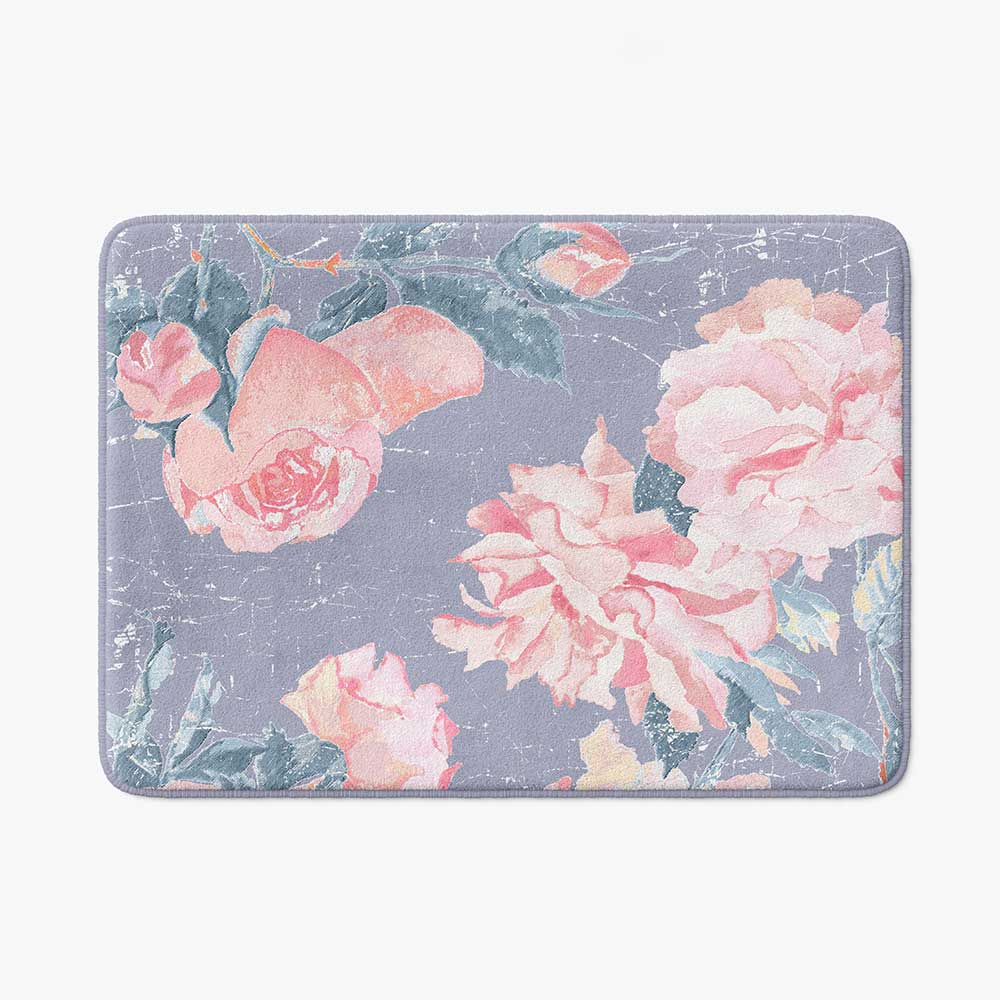 A vintage pink rose watercolor floral bath mat in lavender purple, perfect for adding elegance to any bathroom. Mold and mildew resistant, quick-drying, non-slip plush microfiber, washable.