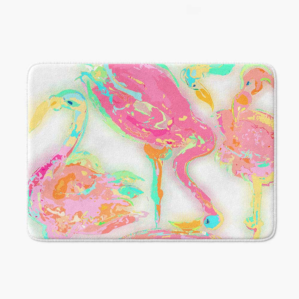 A vibrant pink flamingo tropical bathroom bath mat, perfect for adding a touch of tropical flair to any bathroom. Mold and mildew resistant, quick-drying, non-slip plush microfiber, washable.