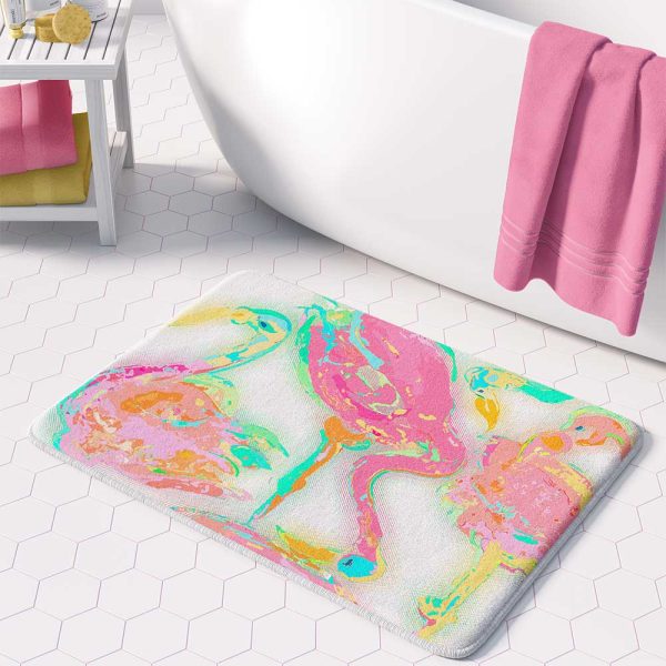 A vibrant pink flamingo tropical bathroom bath mat, perfect for adding a touch of tropical flair to any bathroom. Mold and mildew resistant, quick-drying, non-slip plush microfiber, washable.