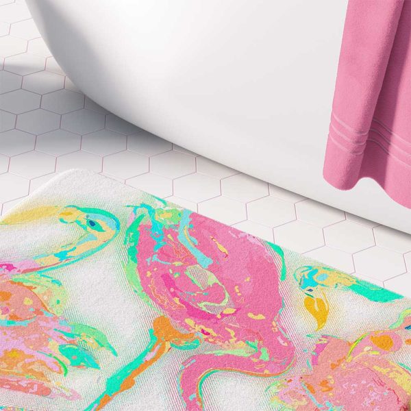 A vibrant pink flamingo tropical bathroom bath mat, perfect for adding a touch of tropical flair to any bathroom. Mold and mildew resistant, quick-drying, non-slip plush microfiber, washable.