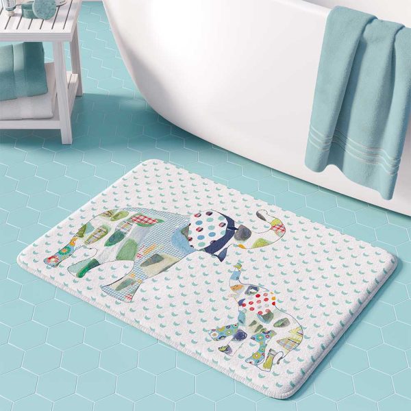 A white microfiber non slip bath mat for kids featuring a playful blue and green elephant print. Mold and mildew resistant, plush, soft, non-slip, machine washable, and quick drying.