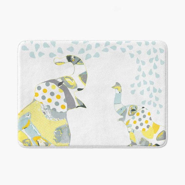 A kids bath mat featuring a charming grey and yellow elephant print, perfect for a kids' bathroom. Mold and mildew resistant, quick-drying, non-slip plush microfiber, washable.