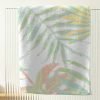 Close-up of abstract tropical apricot palm leaves pattern on artwork.