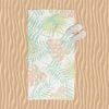 Beach towel with abstract tropical apricot palm leaves pattern.