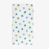 Full view of a white cotton polyester velour bath towel with blue and green watercolor polka dots.