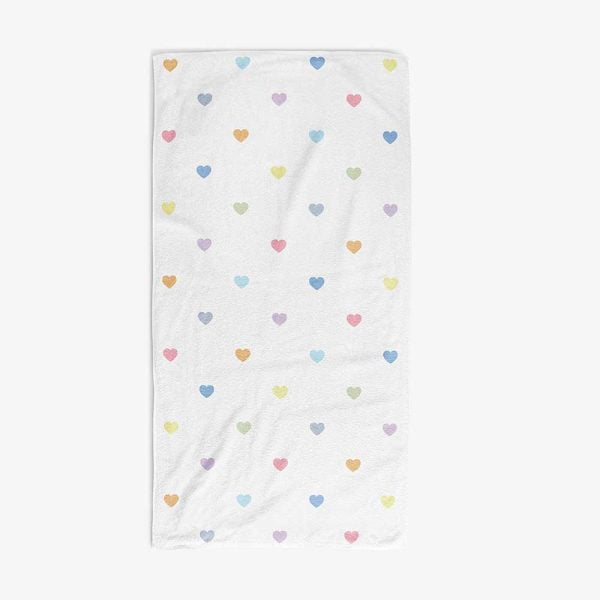 white bath towel with pastel love hearts