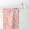 Hand towel with elegant tropical coral pink pattern.
