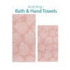 Bath and hand towel set with elegant tropical coral pink pattern.