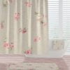 Front view of farmhouse shower curtain with blurred rose floral design.