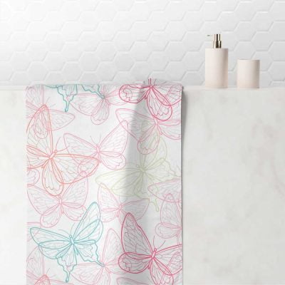 Hand towel with pink and blue butterfly print, ideal for a girl's bathroom.